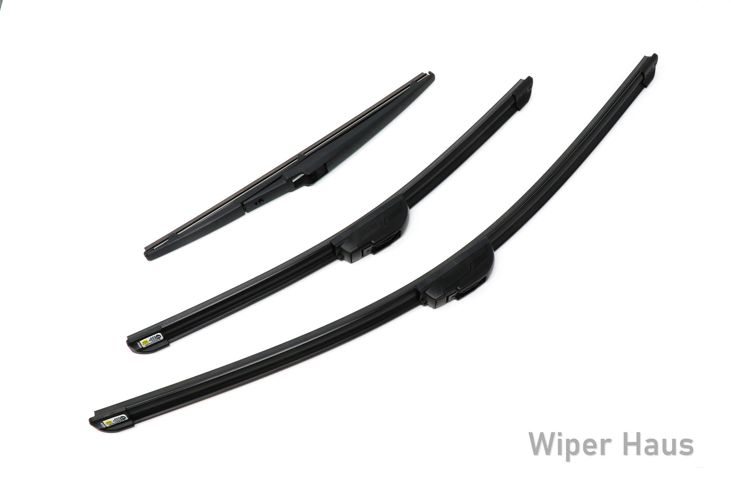 Two Bosch Focus and one Bosch Rear wiper blades on white background
