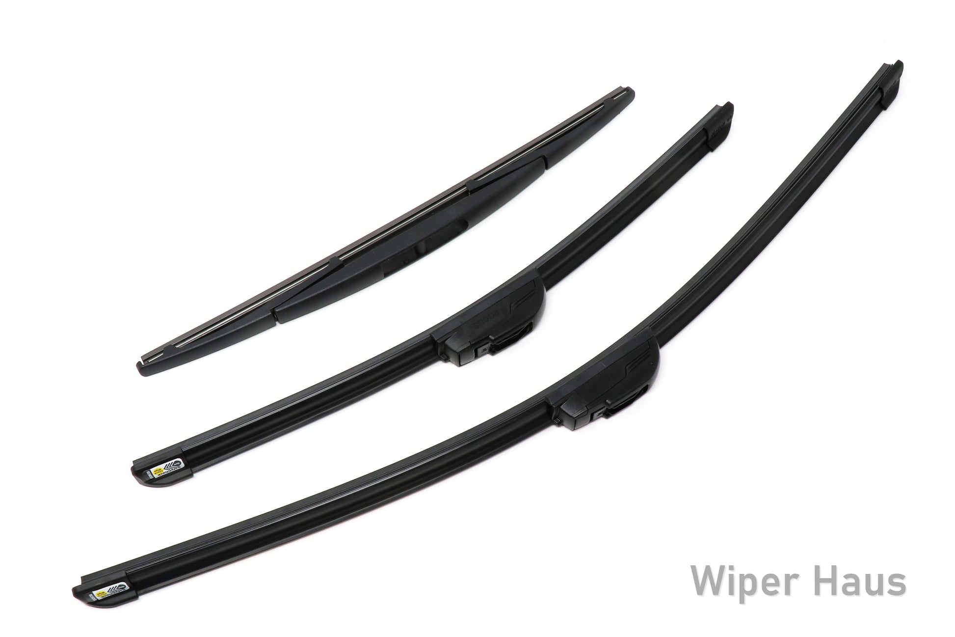 Two Bosch Focus and one Bosch Rear wiper blades on white background