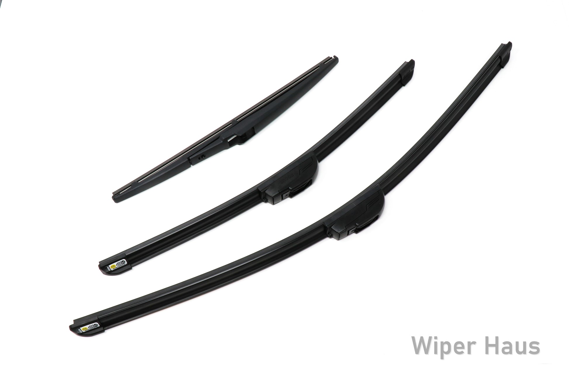 Two Bosch Focus and one Bosch Rear wiper blades on white background