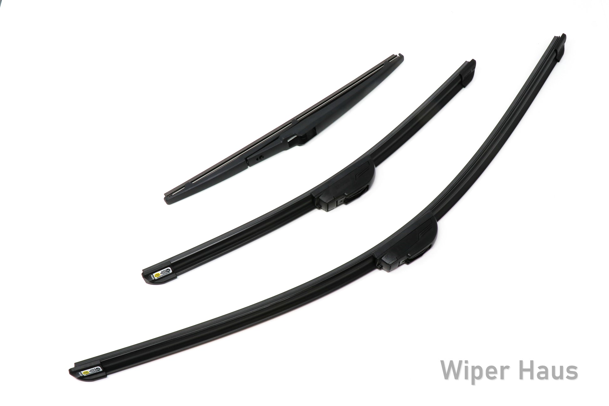Two Bosch Focus and one Bosch Rear wiper blades on white background